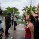 Protesters and police face each other during a rally for George Floyd in Minneapolis on May 26, 2020.